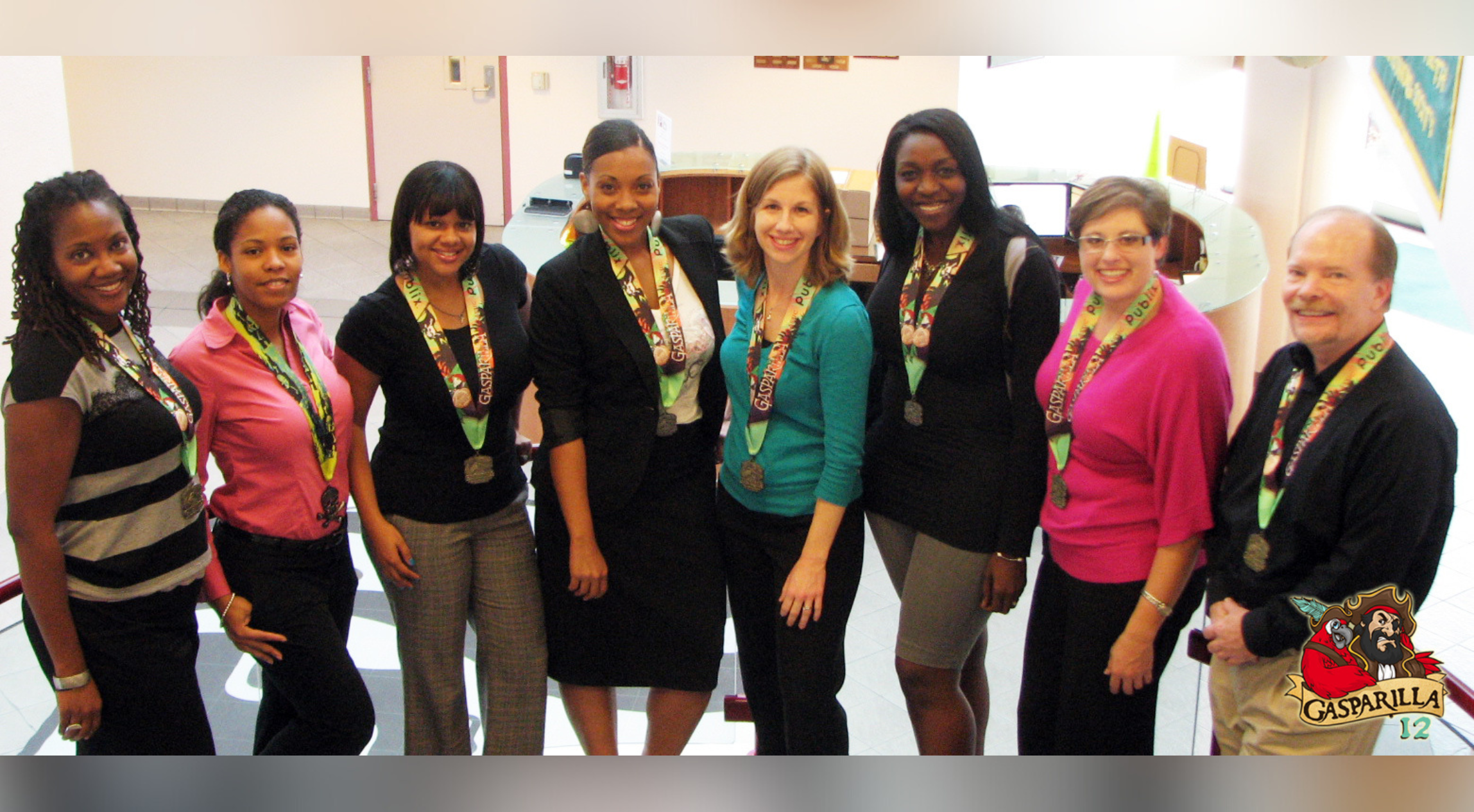 Hogeboom standing and smiling with a large group of educators.