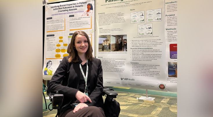 a person smiling with a poster