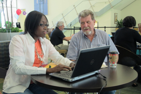 two people looking at computer