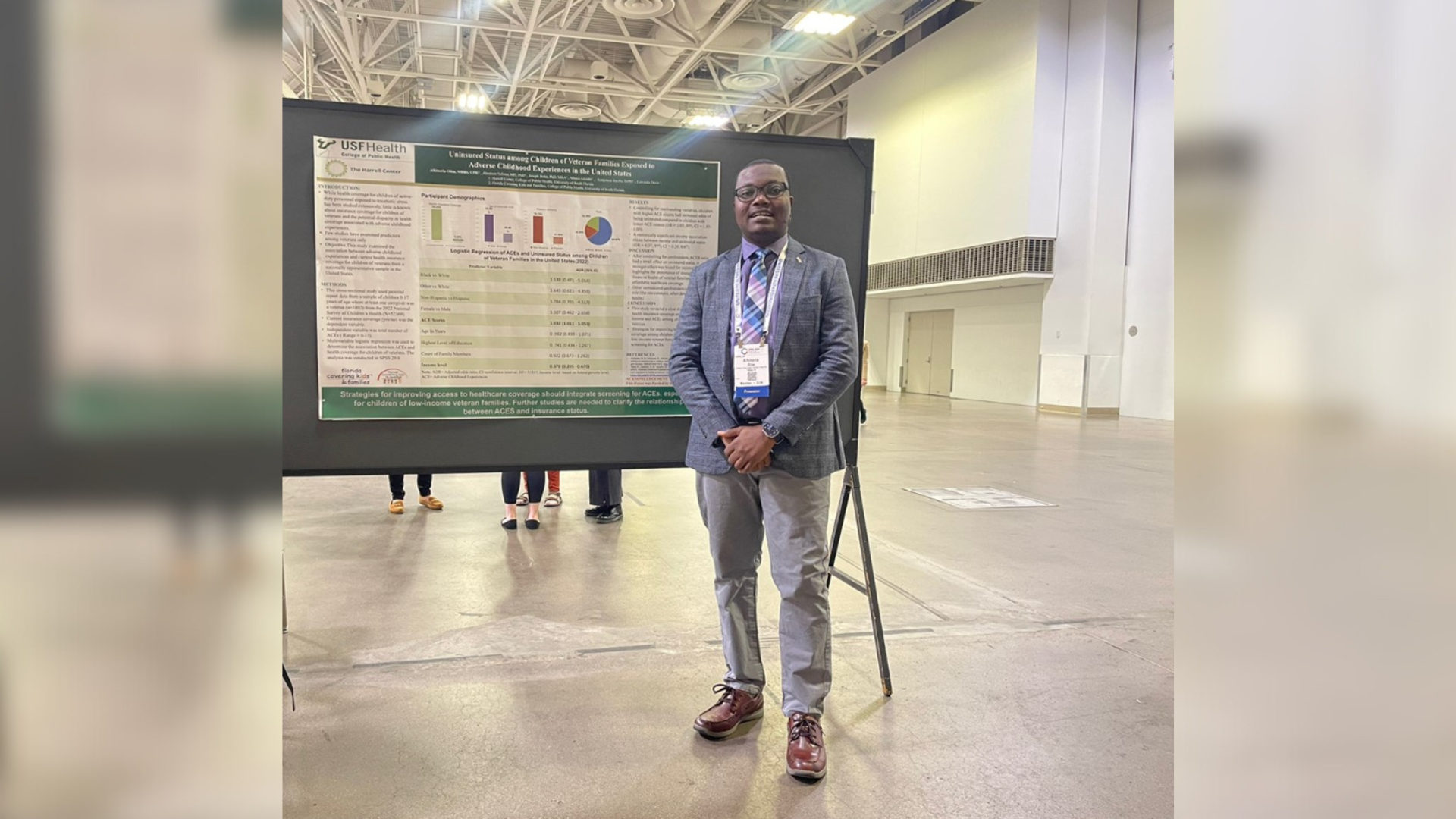Aihinoria Joseph Olisa presenting his research poster.