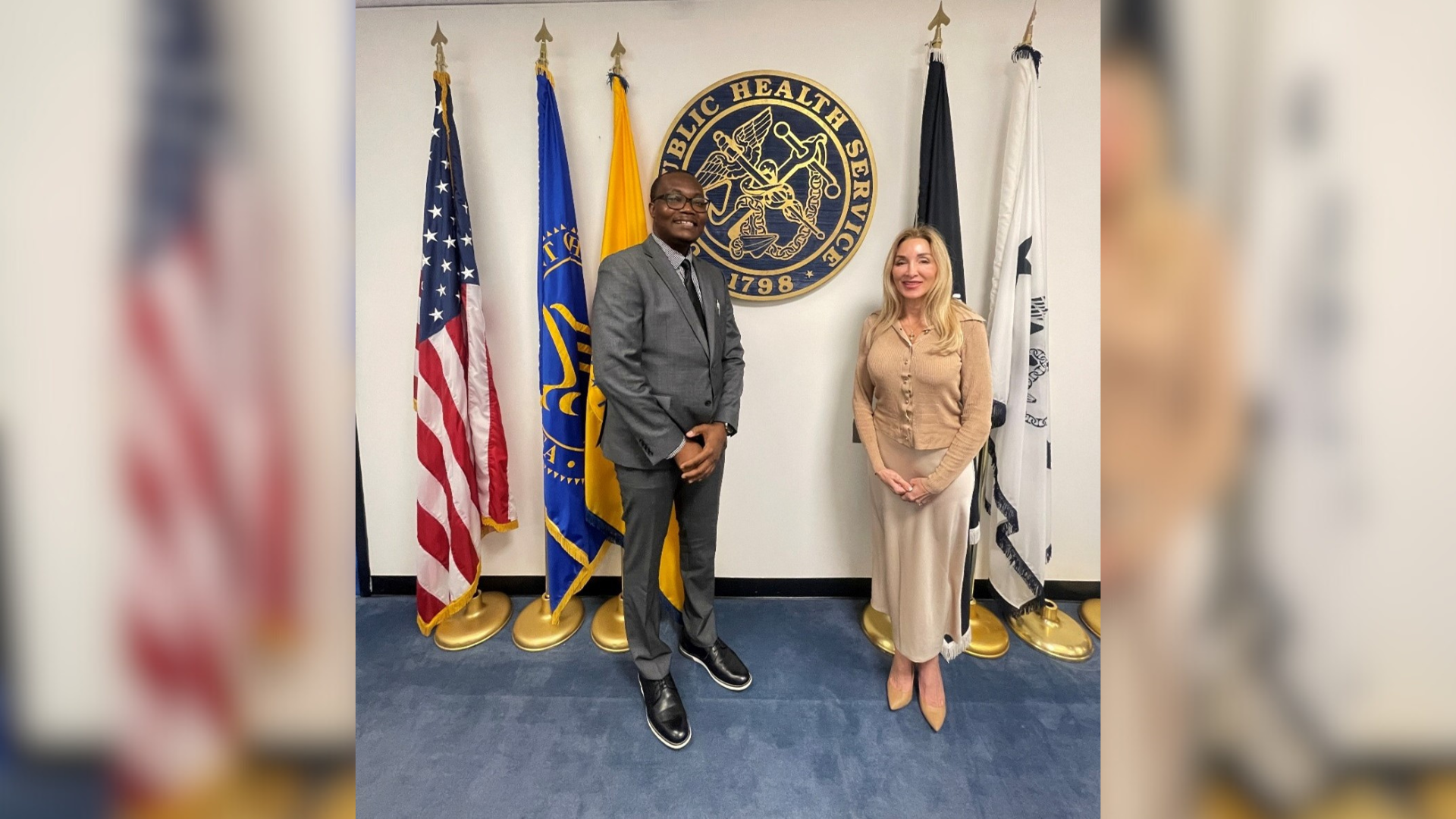 Aihinoria Joseph Olisa standing with Dr. Haridopolos