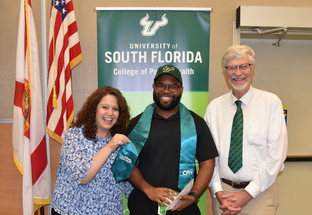 three people smiling