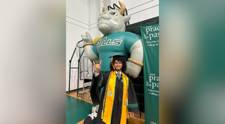 a graduate smiling