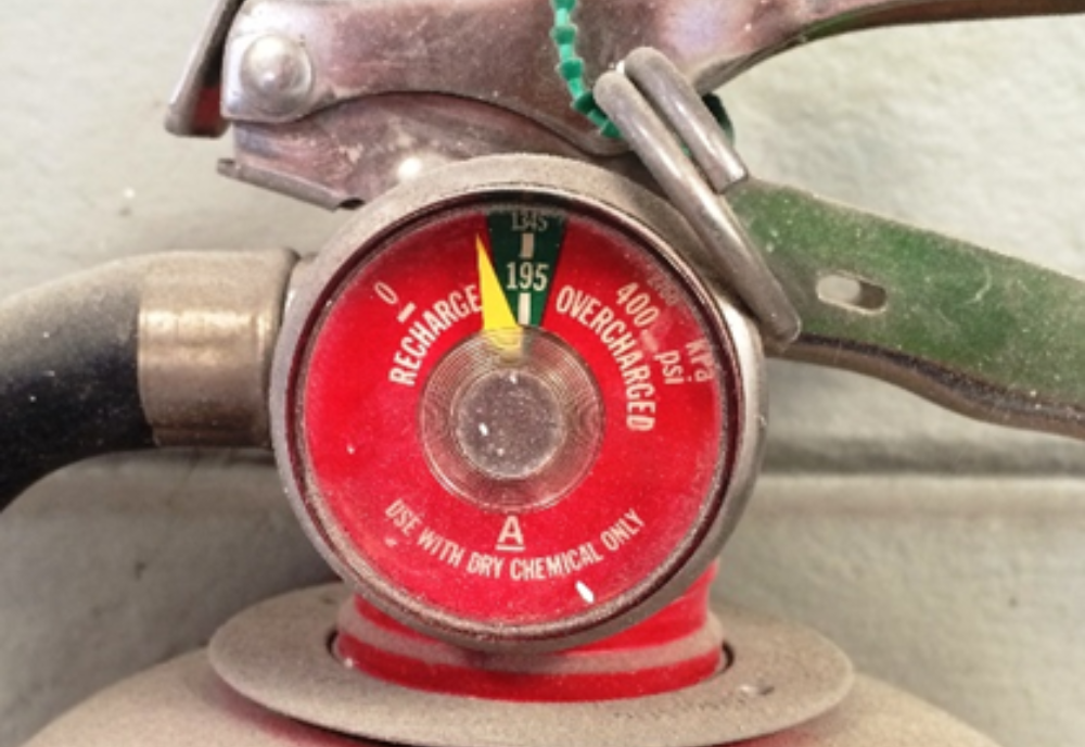 Fire extinguisher needing to be recharged.