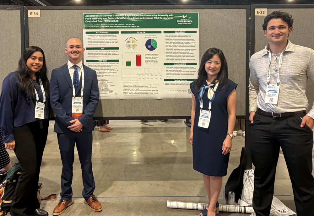 group in front of poster