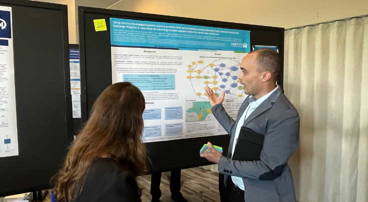 person presenting a poster