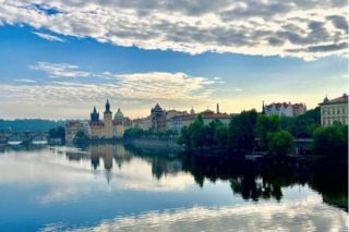Eastern European town with a river running alongside buildings