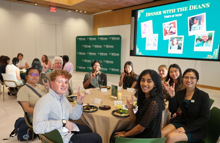 Honors Living Learning Community students sit at a round table with Dean Adams during the Dinner with the Dean event