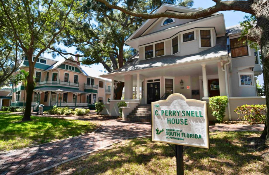 Front of Snell House, street view with a sign out front, reading "C. Perry Snell House"
