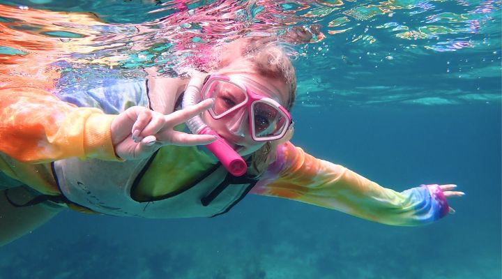 Honors student snorkelling in the turquoise Bahamian waters