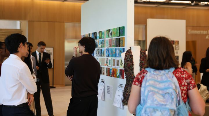 Honors students looking at Climate Teach-In art exhibit.