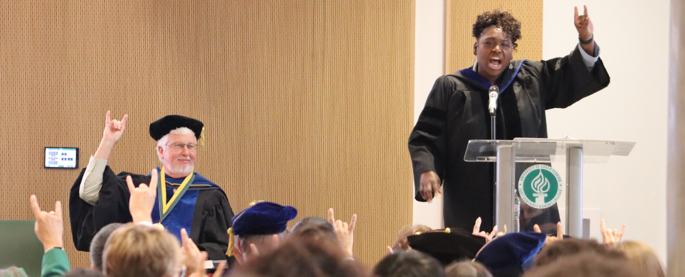 Dr. Thomas leads students and faculty in a unifying chant "Together we are an unstopp-a-bull force"