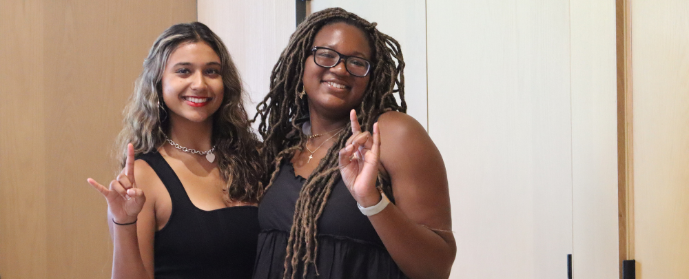 Members of the USF honors choir smile for the camera.