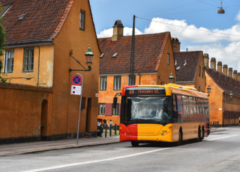 Bus in Copenhagen on streets near houses
