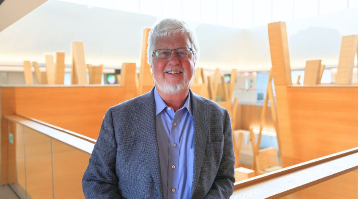 Dean Adams headshot in Honors building