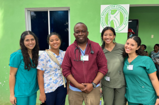Honors students smile with Dr. Keroll