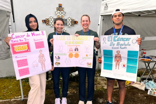 Honors students show their health education posters