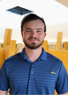 Ethan Tracy headshot in Honors building