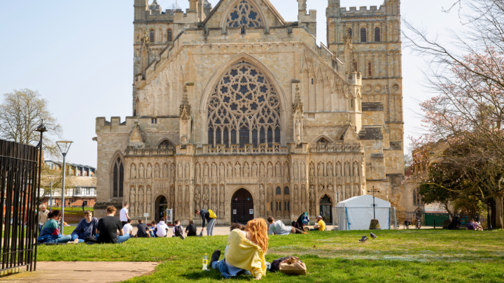 Judy Genshaft Honors College student studies on the lawn at the University of Exeter