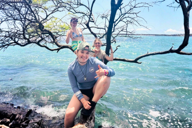 3 students on branch in water