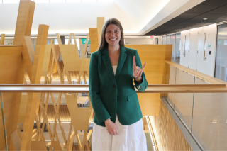 Judy Genshaft Honors College alum and 2024 USF Outstanding Young Alumni award winner Corbyn Lichon poses in the Honors College