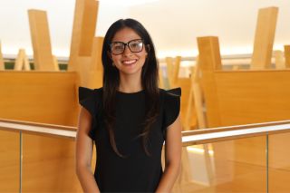 Honors alum Anabella Garcia poses in the Judy Genshaft Honors College.
