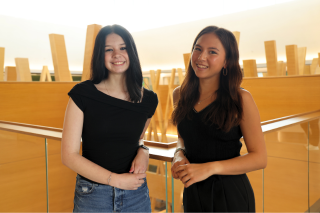 2025 USF Climate-Teach In student leaders Maia Ryan and Katelynn Paciorek smiling in the Honors building.