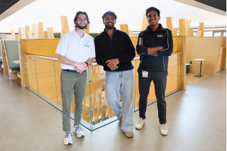Honors alums Parker Olive , Aakash Vijeesh, and Rahul Jain pose in the Judy Genshaft Honors College