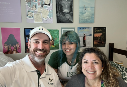 Jo Barringer smiles with her parents.