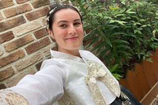 Selfie-stye photograph of USF Honors student Mia Finocchiaro wearing traditional South Korean clothing.