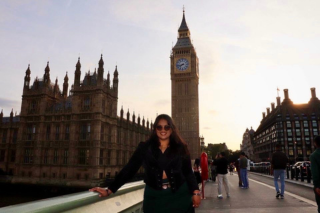 Mridula Singh smiles under the big ben