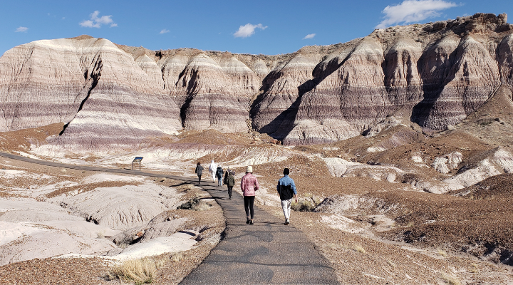 Students walk by moutains.