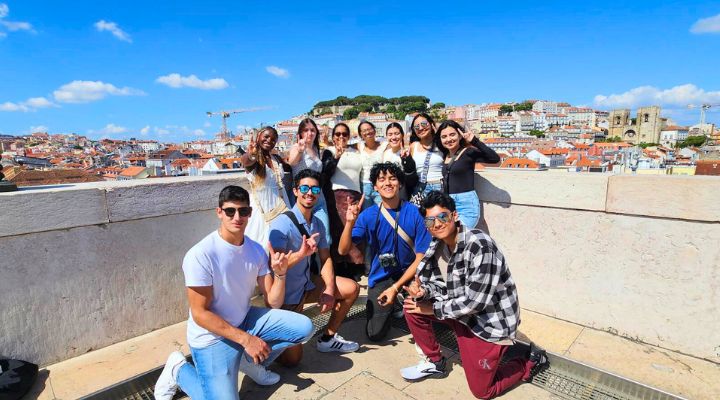 A group of Honors student in front of the Lisbon Skyline