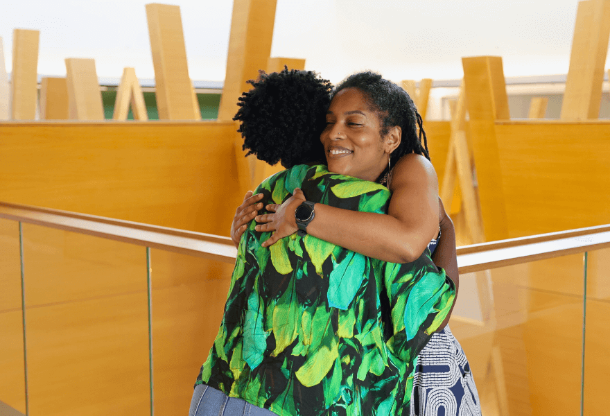 Ulluminair Salim hugging student Temi David