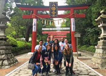Image of ten Honors students posing in front of a traditional Japanese gate linking to the Japan Beyond the Classroom study abroad program page.