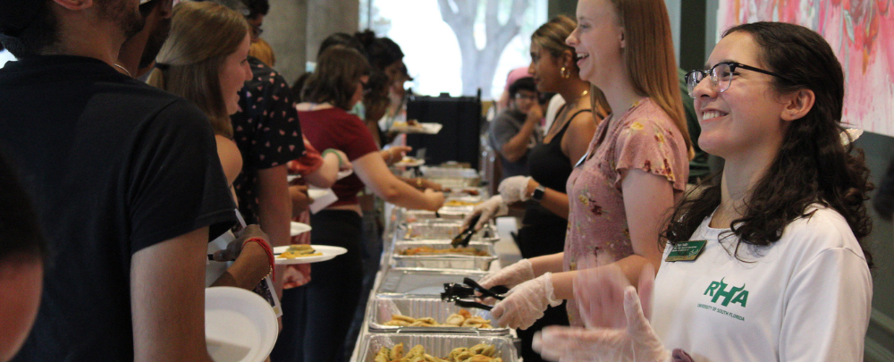 Globull and Honors Ambassadors serve global cuisines to students.