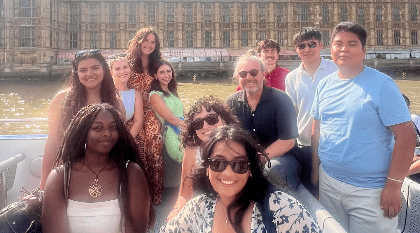 Dr. Benjamin Young and students on a boat on the River Thames