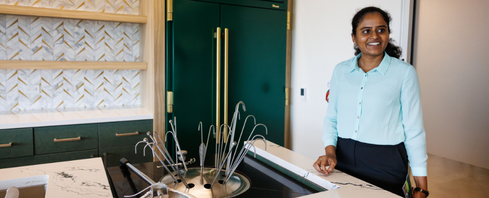 Visitor smiles at the Loraine Genshaft food and culture studio