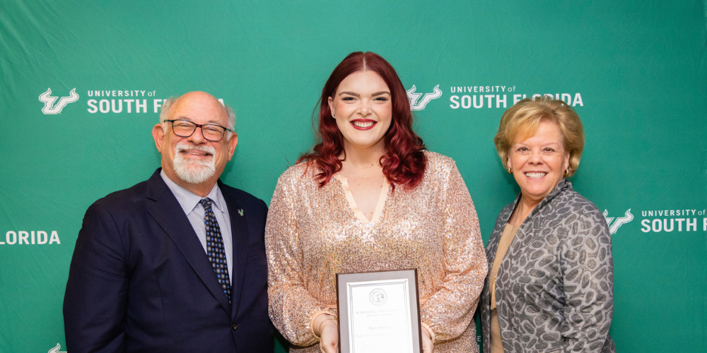 Judy Genshaft Honors College Academic Advisor Dani Soluna poses with USF President Rhea Law and interim Provost Eric Eisenberg.