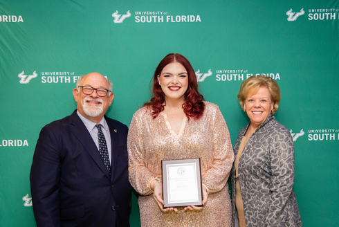 Judy Genshaft Honors College Academic Advisor Dani Soluna poses with USF President Rhea Law and interim Provost Eric Eisenberg.