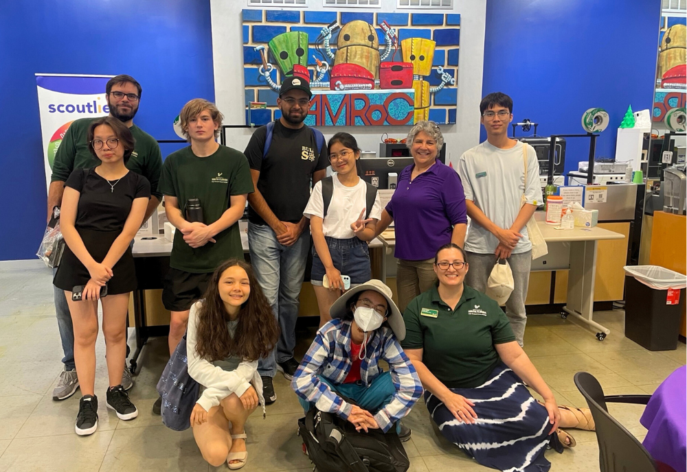 Judy Genshaft Honors College students and staff pose for a picture in the AMRoC Fab Lab in Tampa.