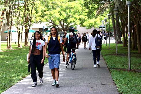 Students walk on USF's Tampa campus
