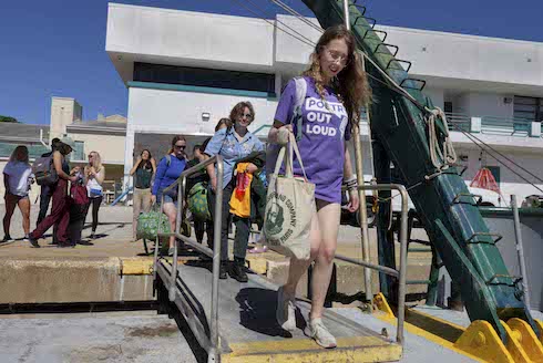 Students from five Honors Colleges in the State University System disembark from a research vessel