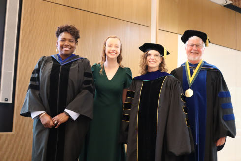 Dr. Sylvia Thomas, Honors student council president Audra Nikolajski, Dr. Lindy Davidson, and Dean Charles Adams smile at the Tampa Campus’s 2023 Honors Convocation Ceremony.