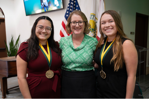 Sarasota-Manatee Judy Genshaft Honors College Assistant Dean Cayla Lanier and two 2023 Honors graduates. 