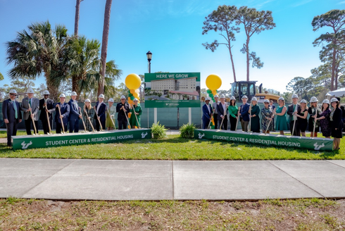 USF Administrators pose with shovels and hard hats as they break ground on new USF Sarasota-Manatee student center and residence hall