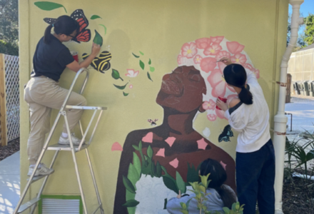 Honors students paint the breath of life mural at the USF botanical gardens