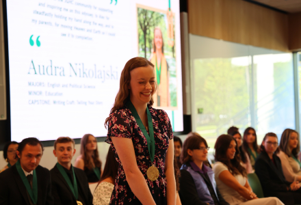 Honors Graduate Audra Nikolajski laughs during the Honors Graduation Celebration Ceremony