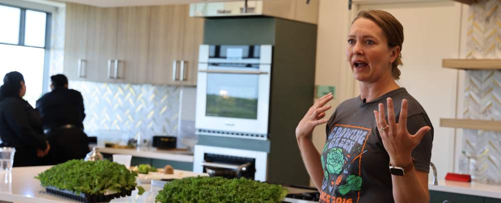 A speaker from Brick Street Farms talks with USF students during a health cooking demonstration in the Judy Genshaft Honors College.