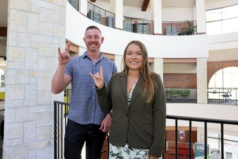 Professor Jordan Howell and Kaylee Eckelman pose with the
